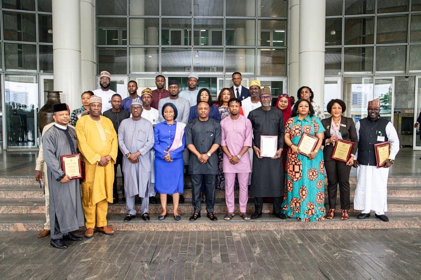 Ambassador Gabriel Aduda presented award for outstanding performance to 31 Members of Staff of the M…
