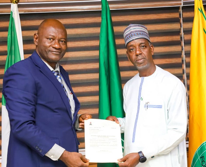 Ambassador Adamu Ibrahim Lamuwa presented Dr. Joseph Peter Ochogwu with Letter of Appointment as the new Director General of IPCR